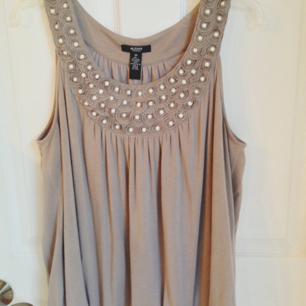 Alfani sleeveless top with rosette trim at neck.
